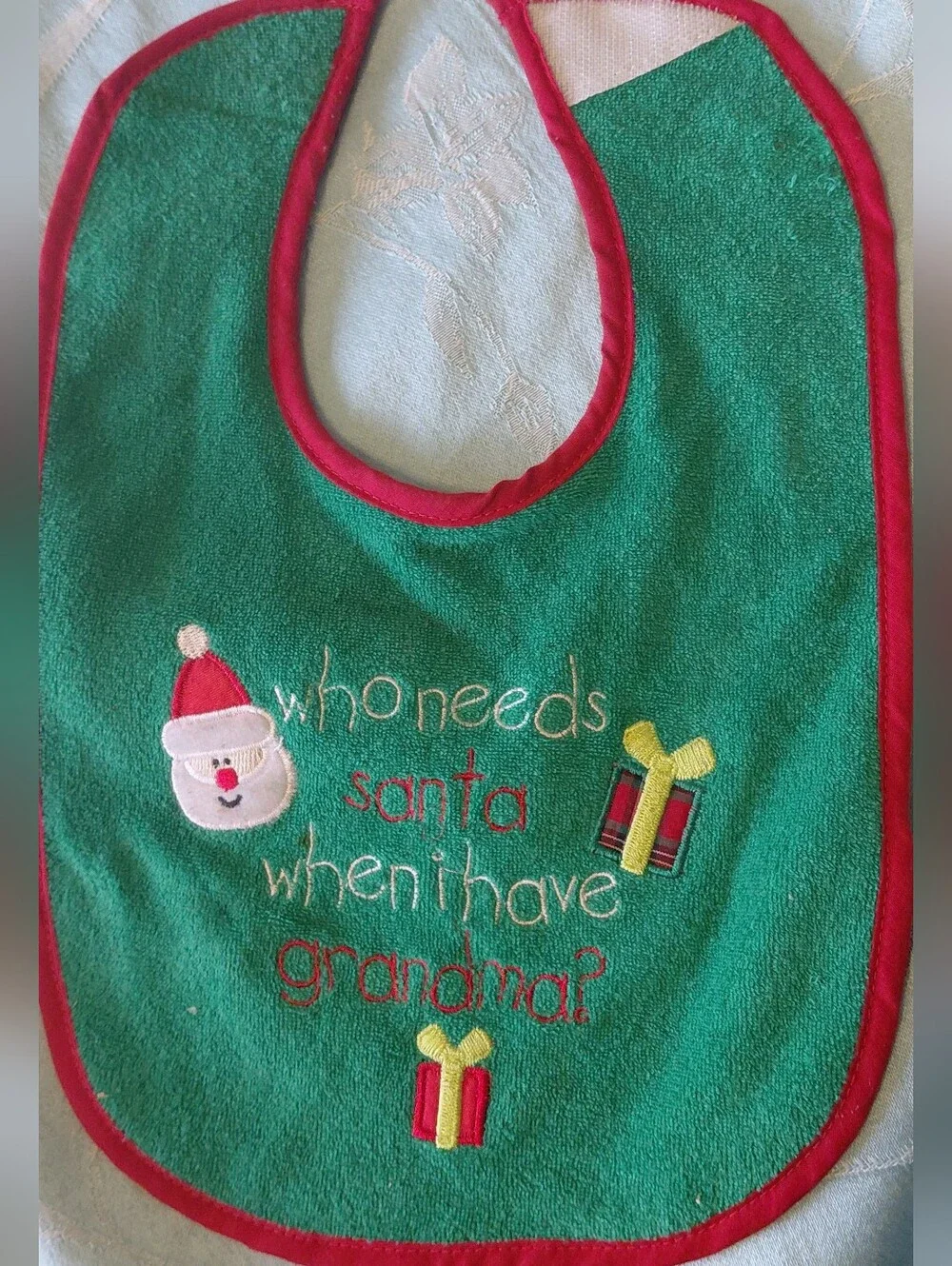 Tender Kisses Green Christmas Bib with Santa and Presents